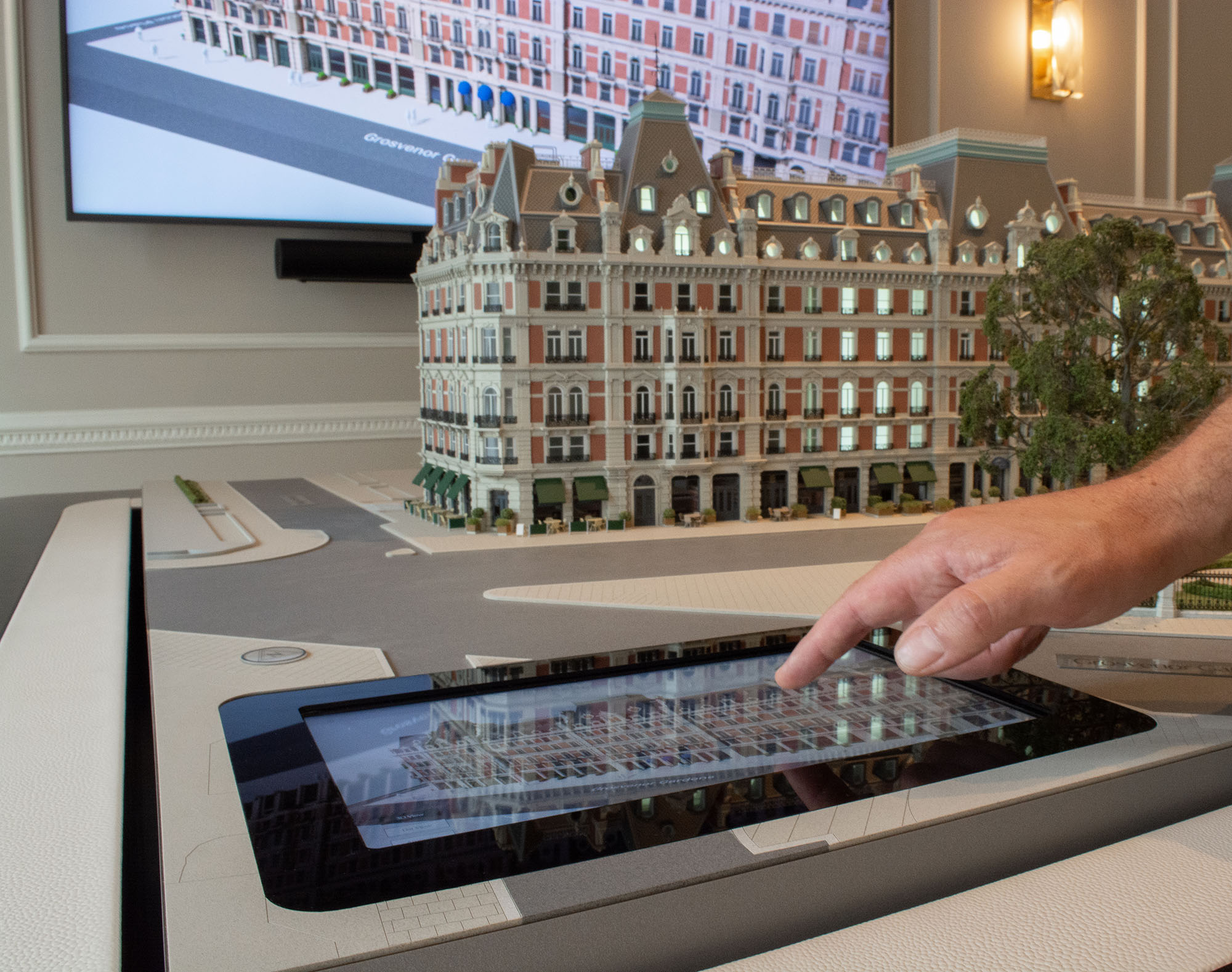 The touchscreen interactive controls scale model lighting at the 8 Eaton Lane marketing suite